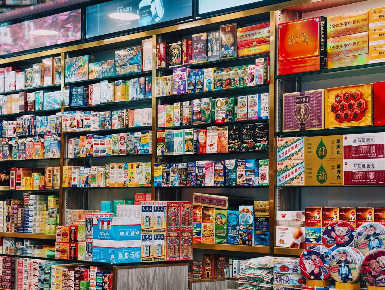 Bright and colorful display of various Asian products on supermarket shelves.